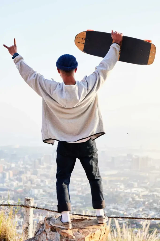 skateboard freedom and mountains with man cheerin.jpg